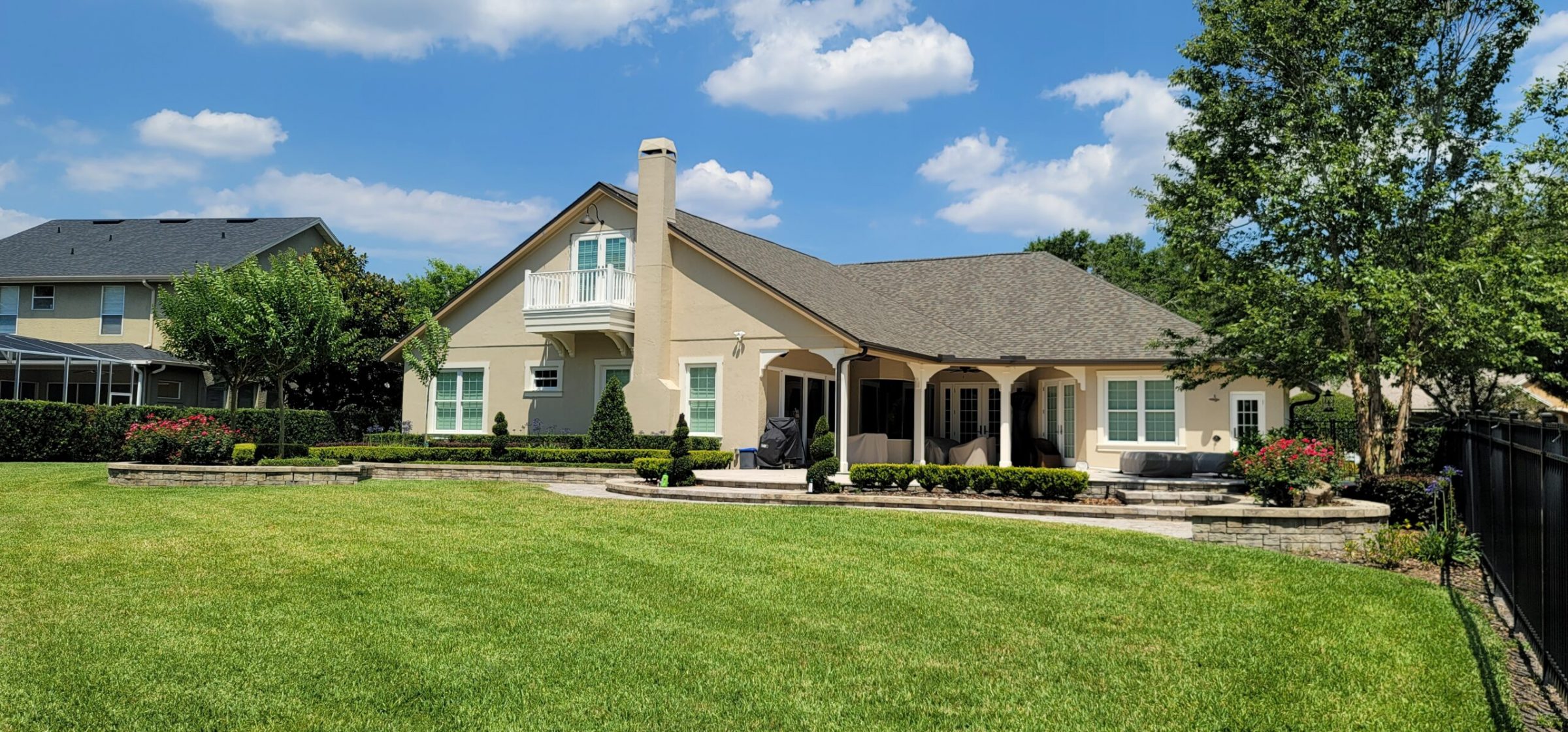Modern house with large green lawn
