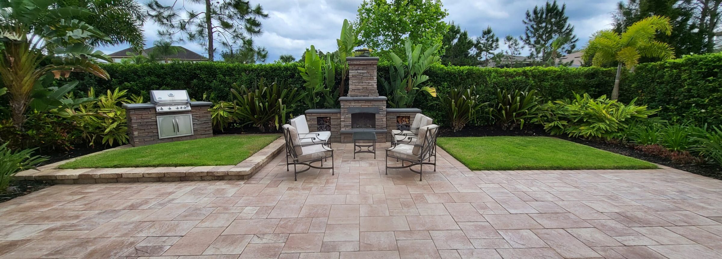 Outdoor patio with grill and seating area
