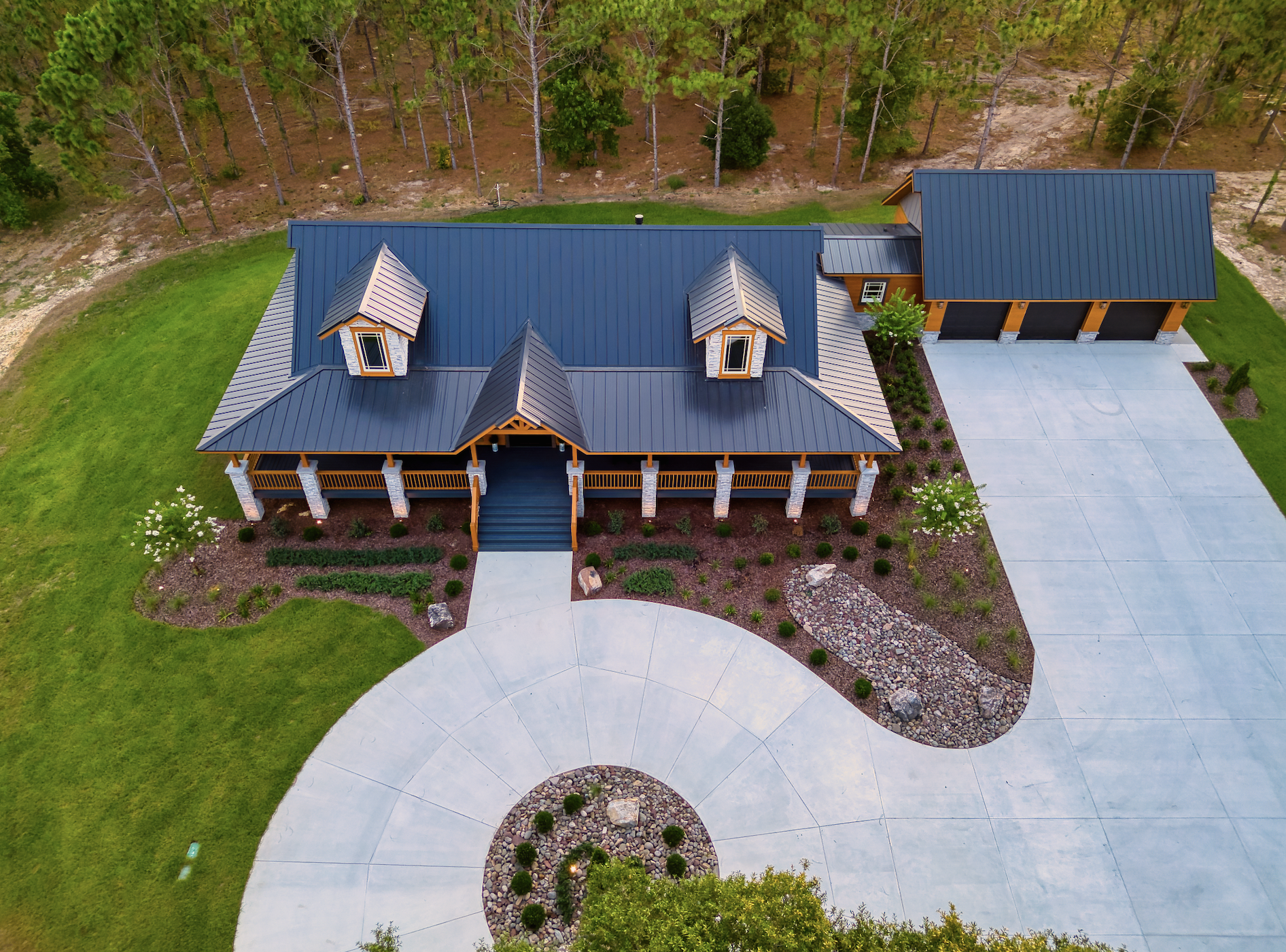 Aerial view of modern house with driveway.
