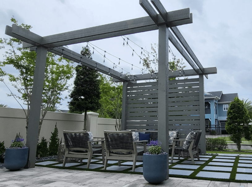 Outdoor patio with pergola and seating area.