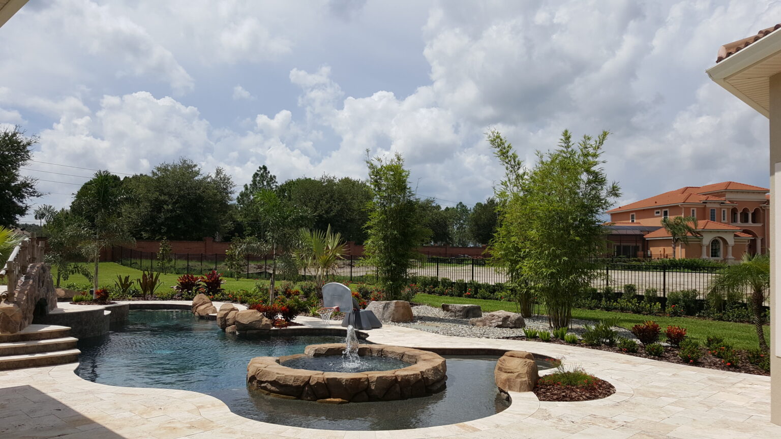 Luxury backyard with pool and garden landscape.