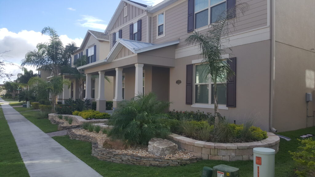 Modern suburban house with landscaped front yard.