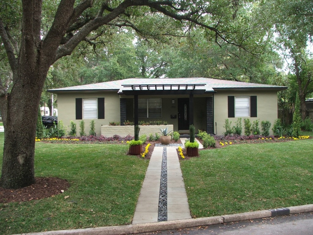 Single-story house with landscaped front yard.