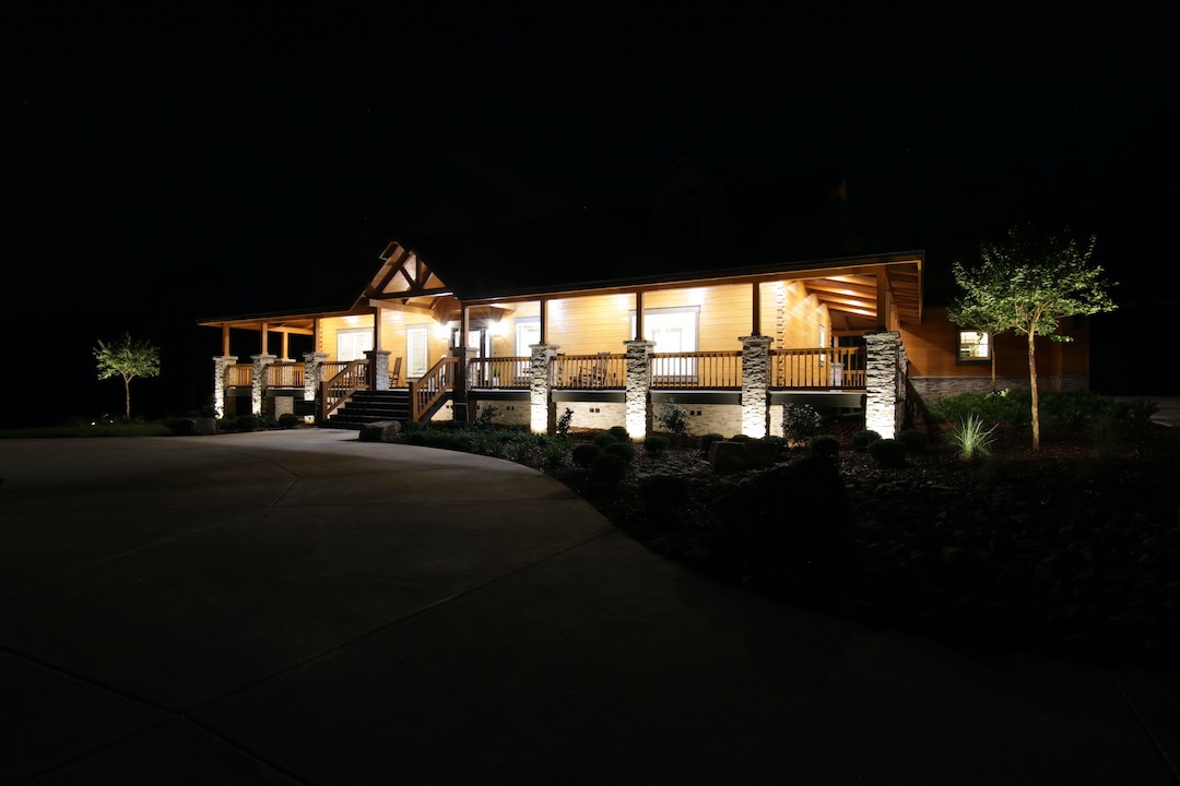 Night view of illuminated wooden house